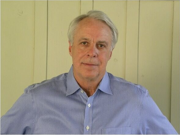 Jonathan Petropoulos headshot yellow background
